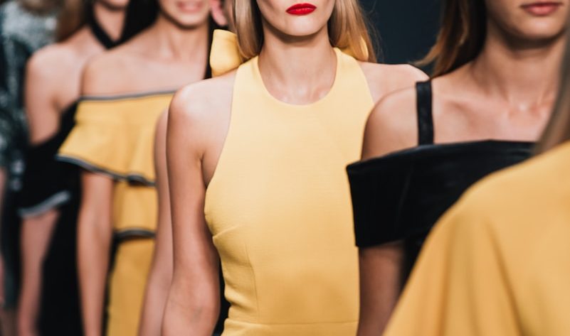 woman wearing yellow sleeveless dress