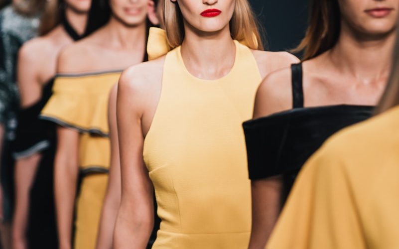 woman wearing yellow sleeveless dress