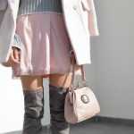 women's pink skirt and gray knee boots outfit