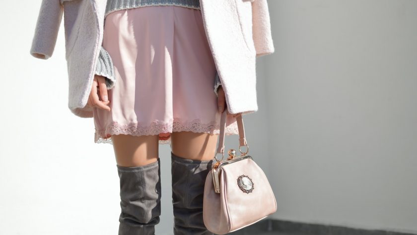 women's pink skirt and gray knee boots outfit