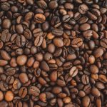 brown coffee beans on brown wooden table