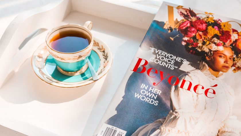 Beyonce magazine near tea on teacup