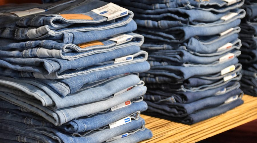 pile of blue denim jeans lot