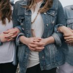 woman in blue denim jacket and white shirt