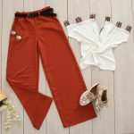 red pants on white wooden surface