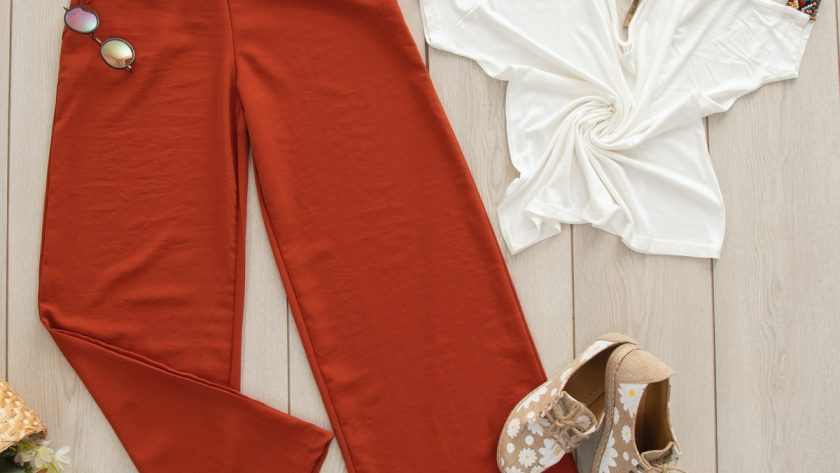 red pants on white wooden surface