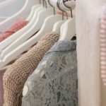 clothes hanging on white rack
