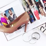 heeled sandal on top of magazine