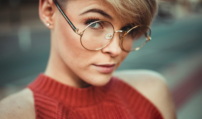 woman wearing round eyeglasses